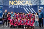 U12 San Pablo Lobos youth soccer team celebrating their championship win in the U12 Platinum Cup at the NorCal State Cup.