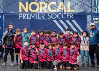 U12 San Pablo Lobos youth soccer team celebrating their championship win in the U12 Platinum Cup at the NorCal State Cup.